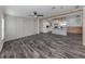 Bright living room featuring luxury vinyl plank flooring, wood beam accents, and painted accent wall at 127 Nautical Dr, North Port, FL 34287