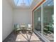 Bright and airy patio with seating area, perfect for relaxing outdoors at 129 Clifton Way, Venice, FL 34292