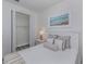 Bright bedroom with a queen-size bed and built-in closet at 129 Clifton Way, Venice, FL 34292