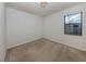 Bedroom with neutral walls, carpet flooring and single window at 13240 Amerigo Ln, Venice, FL 34293