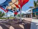 Outdoor seating area with shade sails near a waterfront at 13240 Amerigo Ln, Venice, FL 34293