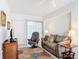 Spacious living room with comfortable seating and access to a patio at 200 Park N Blvd # 103, Venice, FL 34285