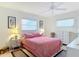 Bedroom with double bed, ceiling fan, and white dresser at 200 Park N Blvd # 103, Venice, FL 34285