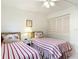 Guest bedroom with twin beds and shared closet at 200 Park N Blvd # 103, Venice, FL 34285