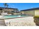 Community pool with surrounding patio and seating at 200 Park N Blvd # 103, Venice, FL 34285