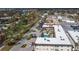 Aerial view of a community with pool, showcasing building exteriors and surrounding landscape at 200 Park N Blvd # 103, Venice, FL 34285