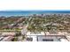 Aerial view showing building exterior and oceanfront neighborhood at 200 Park N Blvd # 103, Venice, FL 34285