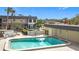 Community pool with surrounding patio and seating at 200 Park N Blvd # 103, Venice, FL 34285
