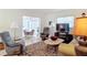 Living room with comfortable seating and a view of the dining area at 200 Park N Blvd # 103, Venice, FL 34285