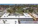 Aerial view showing building exterior, parking, and nearby ocean at 200 Park N Blvd # 103, Venice, FL 34285