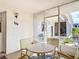 Cozy screened-in patio with table and chairs, perfect for relaxing at 200 Park N Blvd # 103, Venice, FL 34285