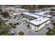 Aerial view of a condo complex with a pool and ample parking at 200 Park N Blvd # 103, Venice, FL 34285
