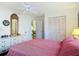 Bedroom with double bed, ceiling fan, and white dresser at 200 Park N Blvd # 103, Venice, FL 34285