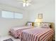 Guest bedroom with twin beds and shared closet at 200 Park N Blvd # 103, Venice, FL 34285