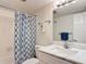 Bathroom with marble vanity and shower/tub combo at 200 Park N Blvd # 103, Venice, FL 34285