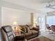 Relaxing living room with leather recliner, sofa, and end tables at 200 Park N Blvd # 103, Venice, FL 34285