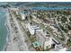 Aerial view of beachfront properties and coastal community at 200 The Esplanade N # C17, Venice, FL 34285