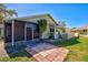 Backyard with patio, screened enclosure, and grassy area at 3023 Seawind Cir # 14B, Venice, FL 34293