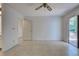 Bright bedroom with tile floors and door to exterior at 3023 Seawind Cir # 14B, Venice, FL 34293