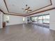 Large living area with wood-look floors and access to the backyard at 333 Cipriani Way, North Venice, FL 34275