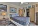 Bright bedroom with a double bed, dresser, and closet at 472 Sharks Pt, North Port, FL 34287