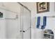 Clean bathroom with shower and linen storage at 472 Sharks Pt, North Port, FL 34287