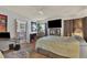 Main bedroom with TV, en-suite bathroom, and ample closet space at 472 Sharks Pt, North Port, FL 34287
