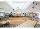 Large community hall with hardwood floors, tables, and chairs, perfect for events at 472 Sharks Pt, North Port, FL 34287