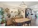 Cozy dining area with a table and chairs near the kitchen at 472 Sharks Pt, North Port, FL 34287