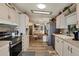 Updated kitchen with stainless steel appliances and ample counter space at 472 Sharks Pt, North Port, FL 34287