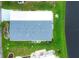Top-down view of a manufactured home's roof and backyard at 472 Sharks Pt, North Port, FL 34287