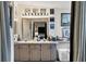 Double vanity bathroom with large mirror and plenty of storage at 472 Sharks Pt, North Port, FL 34287