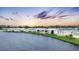 Waterfront community of manufactured homes at sunset at 472 Sharks Pt, North Port, FL 34287