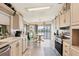 Kitchen boasts ample cabinetry and modern appliances at 472 Sharks Pt, North Port, FL 34287