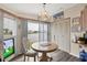 Bright kitchen with water view, breakfast nook, and updated flooring at 472 Sharks Pt, North Port, FL 34287