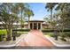 Attractive community clubhouse entrance with landscaping at 472 Sharks Pt, North Port, FL 34287