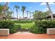 Landscaped courtyard with lush greenery and decorative birds at 472 Sharks Pt, North Port, FL 34287