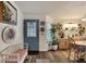 Bright entryway with light blue door and decorative wall art at 472 Sharks Pt, North Port, FL 34287