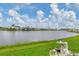 Calm waterfront view with multiple manufactured homes at 472 Sharks Pt, North Port, FL 34287