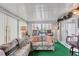 Bright sunroom with couches and view of the water at 472 Sharks Pt, North Port, FL 34287