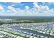 Aerial view of a sprawling community by the water at 472 Sharks Pt, North Port, FL 34287
