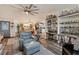Spacious living room features a comfortable seating area and an open floor plan at 472 Sharks Pt, North Port, FL 34287