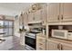 Modern kitchen features stainless steel range and microwave at 472 Sharks Pt, North Port, FL 34287