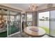 Bright kitchen with water view, breakfast nook, and updated flooring at 472 Sharks Pt, North Port, FL 34287