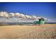 Lifeguard stand on a tranquil beach under a partly cloudy sky at 505 Villas Dr, Venice, FL 34285