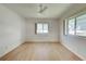 Spacious bedroom with light wood flooring and two windows at 529 Cervina Drive S, Venice, FL 34285