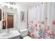 Clean bathroom with starfish shower curtain and white vanity at 605 Apple Ln, Englewood, FL 34223