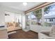 Bright sunroom with view of the backyard and access to living room at 605 Apple Ln, Englewood, FL 34223