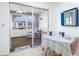 Bright sunroom with seating area and view of the backyard at 605 Apple Ln, Englewood, FL 34223