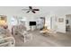 Bright living room featuring comfy seating and a view to the lanai at 605 Apple Ln, Englewood, FL 34223